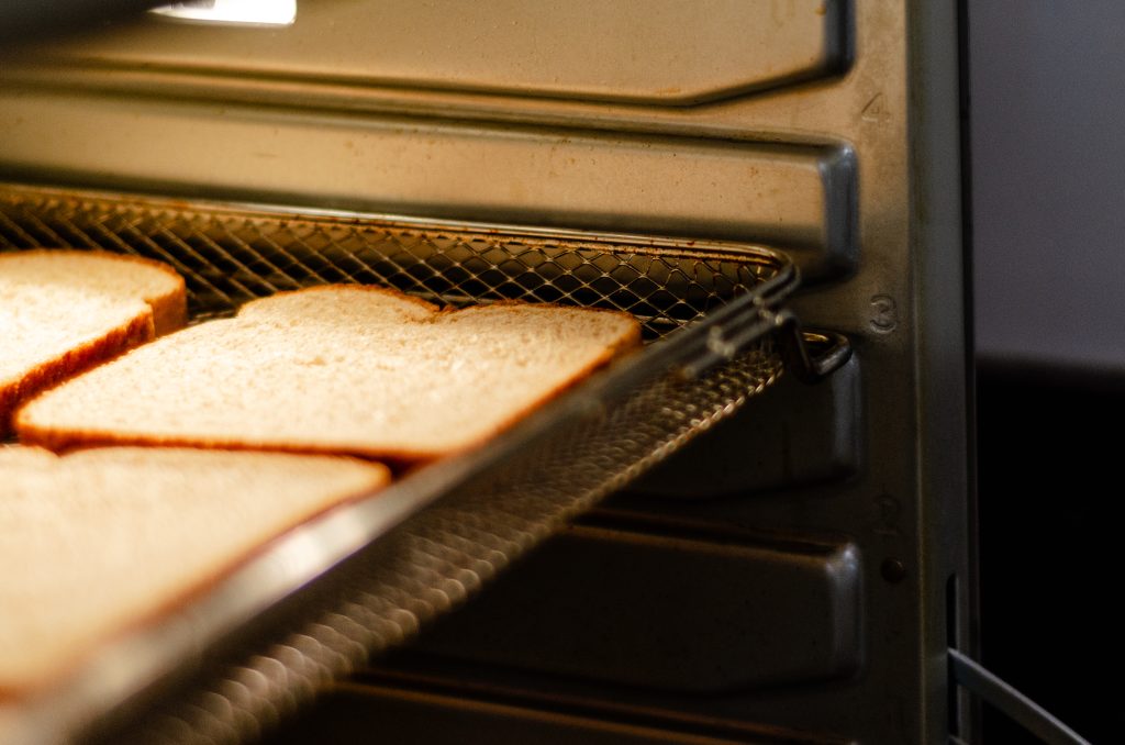 Air Fryer basket holding bread on level 3.