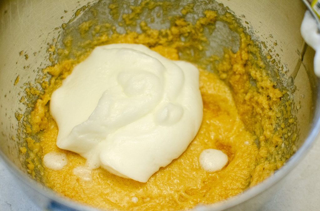 Adding well beaten egg whites to coconut oil, honey, molasses, & granulated monkfruit mixture.